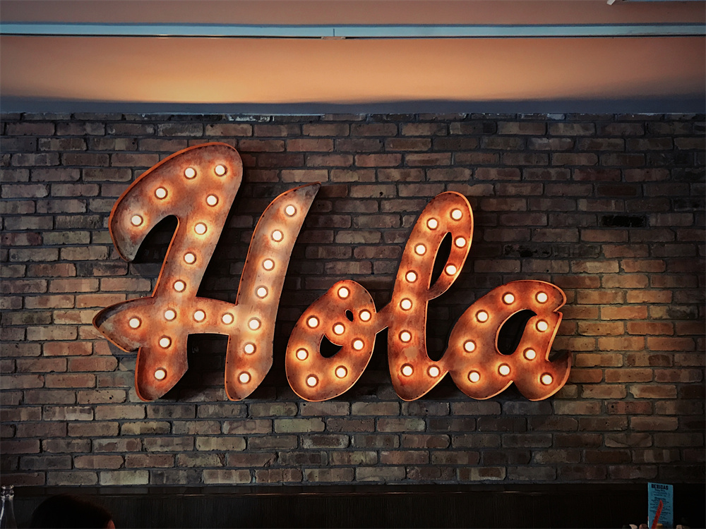 Illuminated Hola sign